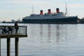 Queen Mary as backdrop for fishermen. Long Beach, CA.