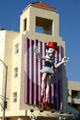 Giant 3D Clown by Jonathan Borofsky on facade of Renaissance Building. Venice, CA.