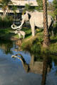 Sculpted mastodons reflected in La Brea Tar Pits in Hancock Park. Los Angeles, CA.