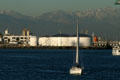 Port of Los Angeles storage tankers against snow-covered mountains. San Pedro, CA.