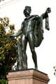 Bronze sculpture of a draped Roman youth by pillar with snake at Henry E. Huntington Library. San Marino, CA.
