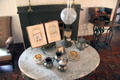 Marble table with coffee set & kerosene lamp at Davis House Museum. San Diego, CA.
