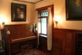 Arts & crafts upright piano with attached lamps at Marston House Museum. San Diego, CA.