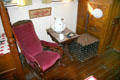 Star of India cabin with rocking chair, pitcher & basin, plus strongbox at Maritime Museum. San Diego, CA.