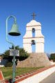 Bell tower at San Bernardino Asistencia with El Camino Real road marker. Redlands, CA