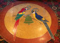 Floor design of two parrots holding mission bell at Mission Inn. Riverside, CA.