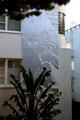 Mural of Spanish Conquistador spying new world on Mallock Apartments. San Francisco, CA.