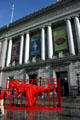 Red Tyrannosaurus Rex sculpture in front of Asian Art Museum. San Francisco, CA.