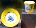 Porcelain cup & saucer in yellow from Vincennes, France at Legion of Honor Museum. San Francisco, CA.