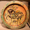 Earthenware disk with horse & cheetah from Eastern Iran at Asian Art Museum. San Francisco, CA.