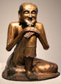 Gilt bronze sculpture of Buddha Shakyamuni as ascetic from China at Asian Art Museum. San Francisco, CA.
