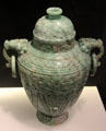 Carved jadeite covered vase with ring handles from China at Asian Art Museum. San Francisco, CA.