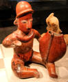 Colima earthenware musician with gourd from West Mexico at de Young Museum. San Francisco, CA.