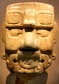 Maya carved stone head of Pax god from Mexico or Guatemala at de Young Museum. San Francisco, CA.