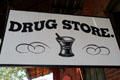 Traditional drug store sign on building at Columbia State Historic Park. Columbia, CA.