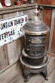 Round Oak wood burning heating stove at Red Barn Museum. San Andreas, CA.
