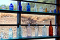 Antique colored bottle display at Red Barn Museum. San Andreas, CA.