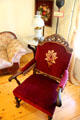 Arm chair in red velvet at Fountain & Tallman Museum. Placerville, CA.