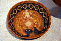 Mission Indian basket tray with design of rattlesnake & horned lizard at Denver Art Museum. Denver, CO.
