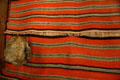 Hispanic wool blanket & Ute tortoise shell rattle at Colorado History Museum. Denver, CO.