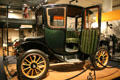 Side view with open door of 100-mile Fritchle Electrics automobile at Colorado History Museum. Denver, CO.