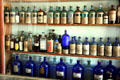 Antique medicine bottles in J.A. Merriam Drug Store at South Park City. Fairplay, CO.