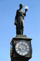 Statue of woman holding lamp atop Wheeler Town Clock. Manitou Springs, CO