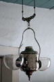 Hung double wick oil lamp at Baca Adobe House. Trinidad, CO.