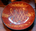 Redware plate at Henry Whitfield State Museum. Guilford, CT.