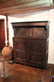 Jacobean-style press cupboard used to store textiles at Henry Whitfield State Museum. Guilford, CT.