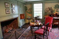 Fireplace, tea table, & Nutting murals in parlor at Joseph Webb House. Wethersfield, CT.