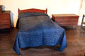 Glazed wool calamanco quilt in dark blue with shine added using pumice stone at Buttolph-Williams House. Wethersfield, CT.
