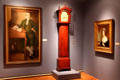 Gallery with portraits & tall clock by Erastus Tracy at Lyman Allyn Art Museum. New London, CT.