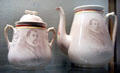 Souvenir china sugar bowl & coffeepot with lithograph of Columbus by H.B.P. Co. at Knights of Columbus Museum. New Haven, CT.