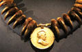 James Buchanan peace medal on bear claw necklace at National Museum of the American Indian. Washington, DC.
