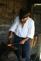 Blacksmith making a nail at Colonial Spanish Quarter Museum. St Augustine, FL.