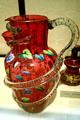 American pitcher of red glass with snake handle at Lightner Museum, St Augustine, FL