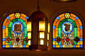 Jewish symbols on stained-glass windows flank Art Deco lamp in Jewish Museum of Florida. Miami Beach, FL.