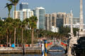 Condo buildings line Biscayne Bay beyond Vizcaya waterfront. Miami, FL.