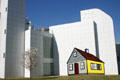 Painting of yellow House 3 by Roy Lichtenstein against Richard Meier's wing of High Museum of Art. Atlanta, GA.