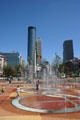 Fountain of Rings of Centennial Olympic Park with skyline of Atlanta. Atlanta, GA.