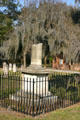 Fenced pillar tomb under Spanish moss Colonial Park Burying Ground. Savannah, GA.