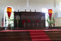 Altar of Kawaiaha'o Church flanked by Hawaiian royal feather standards. Honolulu, HI.