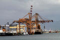 Container port cranes in Honolulu harbor. Honolulu, HI.