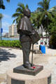 Statue of Prince Jonah Kuhio Kalaniana'ole on beach in Waikiki. Waikiki, HI.