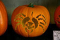 Pottery craft jack-o-lantern carved with spider. High Amana, IA.