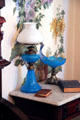Blue glass oil lamp & bowl on metal pedestal at Dodge House. Council Bluffs, IA.