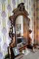 Vanity mirror in top-floor bedroom at Dodge House. Council Bluffs, IA.