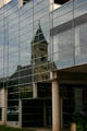 St. Ambrose Cathedral reflected in Convention Center. Des Moines, IA.