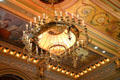 Chandelier & ceiling murals in Senate chamber of Iowa State Capitol. Des Moines, IA.